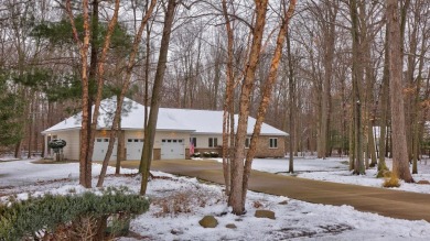 Nestled in the tranquil embrace of Timber Point Estates, 9102 on The Timbers Golf Club in Michigan - for sale on GolfHomes.com, golf home, golf lot