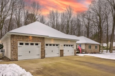 Nestled in the tranquil embrace of Timber Point Estates, 9102 on The Timbers Golf Club in Michigan - for sale on GolfHomes.com, golf home, golf lot