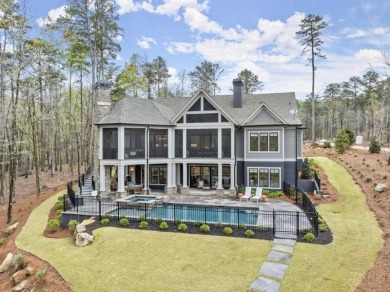 Indulge in the epitome of lakeside luxury with this exquisite on Reynolds Lake Oconee - The Oconee in Georgia - for sale on GolfHomes.com, golf home, golf lot