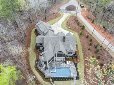 Indulge in the epitome of lakeside luxury with this exquisite on Reynolds Lake Oconee - The Oconee in Georgia - for sale on GolfHomes.com, golf home, golf lot