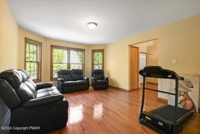 Step inside this 4-bed, 2.5 bath Colonial in the sought after on Country Club of the Poconos Golf Course in Pennsylvania - for sale on GolfHomes.com, golf home, golf lot