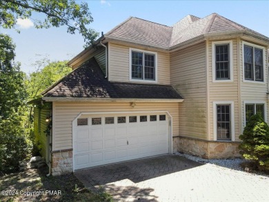 Step inside this 4-bed, 2.5 bath Colonial in the sought after on Country Club of the Poconos Golf Course in Pennsylvania - for sale on GolfHomes.com, golf home, golf lot