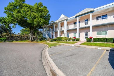 Stunning End-Unit Condo with Pond Views in a Vibrant 55+ on On Top Of The World Golf Course in Florida - for sale on GolfHomes.com, golf home, golf lot