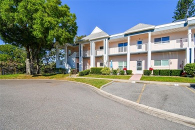 Stunning End-Unit Condo with Pond Views in a Vibrant 55+ on On Top Of The World Golf Course in Florida - for sale on GolfHomes.com, golf home, golf lot