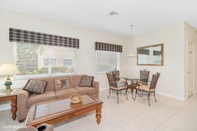 First floor corner unit with lake, golf and preserve views. Very on The Legacy Golf and Tennis Club in Florida - for sale on GolfHomes.com, golf home, golf lot