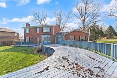 Situated on the 16th hole of Elk Run Golf Course, this spacious on Jeffersonville Elks Golf Club in Indiana - for sale on GolfHomes.com, golf home, golf lot