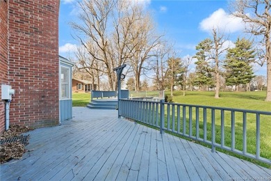 Situated on the 16th hole of Elk Run Golf Course, this spacious on Jeffersonville Elks Golf Club in Indiana - for sale on GolfHomes.com, golf home, golf lot