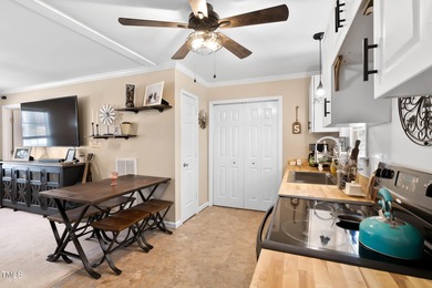 A MUST SEE! Charming 2-Bedroom, 2-Bathroom Cottage in the Gated on River Golf and Country Club at Lake Royale in North Carolina - for sale on GolfHomes.com, golf home, golf lot