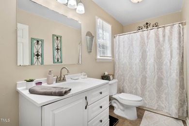 A MUST SEE! Charming 2-Bedroom, 2-Bathroom Cottage in the Gated on River Golf and Country Club at Lake Royale in North Carolina - for sale on GolfHomes.com, golf home, golf lot