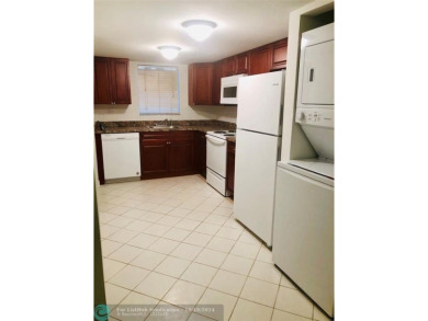 55+ adult community. *CONVENIENT 1ST FLOOR CORNER UNIT WITH on Woodlands Country Club in Florida - for sale on GolfHomes.com, golf home, golf lot