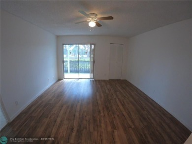 55+ adult community. *CONVENIENT 1ST FLOOR CORNER UNIT WITH on Woodlands Country Club in Florida - for sale on GolfHomes.com, golf home, golf lot