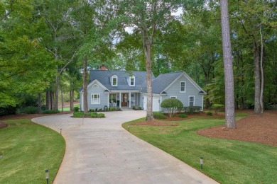 Perched above the green on the Jack Nicolas signature 5th hole on Great Waters Course At Reynolds Plantation in Georgia - for sale on GolfHomes.com, golf home, golf lot