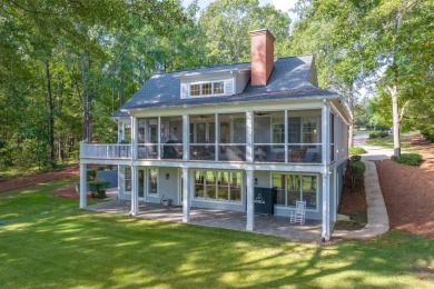 Perched above the green on the Jack Nicolas signature 5th hole on Great Waters Course At Reynolds Plantation in Georgia - for sale on GolfHomes.com, golf home, golf lot