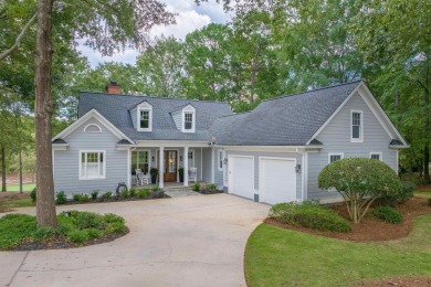 Perched above the green on the Jack Nicolas signature 5th hole on Great Waters Course At Reynolds Plantation in Georgia - for sale on GolfHomes.com, golf home, golf lot