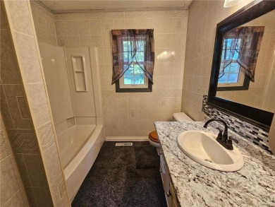 This charming 3-bedroom, 2-bath home offers the potential to add on Wedgewood Cove Golf Club in Minnesota - for sale on GolfHomes.com, golf home, golf lot
