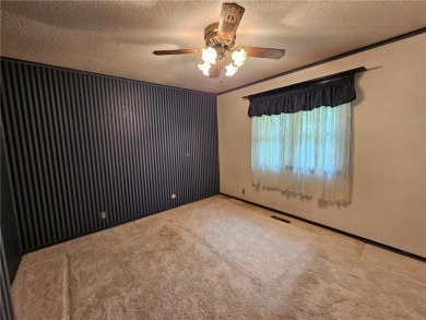 This charming 3-bedroom, 2-bath home offers the potential to add on Wedgewood Cove Golf Club in Minnesota - for sale on GolfHomes.com, golf home, golf lot