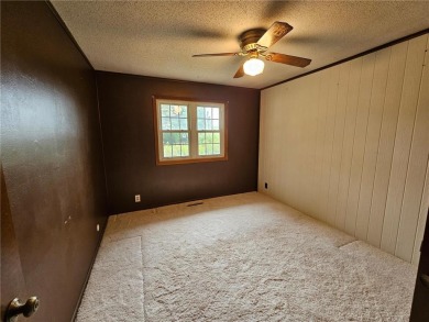 This charming 3-bedroom, 2-bath home offers the potential to add on Wedgewood Cove Golf Club in Minnesota - for sale on GolfHomes.com, golf home, golf lot