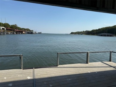 GOLF CART IN GARAGE AND BOAT SLIP IN PRIVATE BOATHOUSE WITH on Tanglewood Resort in Texas - for sale on GolfHomes.com, golf home, golf lot