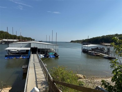 GOLF CART IN GARAGE AND BOAT SLIP IN PRIVATE BOATHOUSE WITH on Tanglewood Resort in Texas - for sale on GolfHomes.com, golf home, golf lot