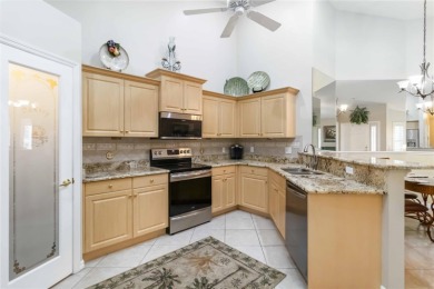 Located in the secure, private gated community of Sabal Trace on Sabal Trace Golf and Country Club in Florida - for sale on GolfHomes.com, golf home, golf lot