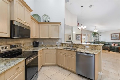 Located in the secure, private gated community of Sabal Trace on Sabal Trace Golf and Country Club in Florida - for sale on GolfHomes.com, golf home, golf lot