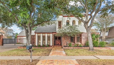 Experience elegant living in this spacious 4-bedroom, 4-bath on Corpus Christi Country Club Golf Course in Texas - for sale on GolfHomes.com, golf home, golf lot