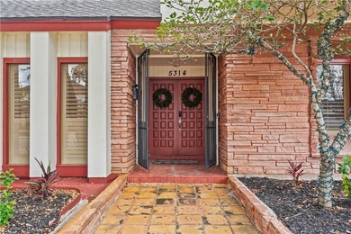 Experience elegant living in this spacious 4-bedroom, 4-bath on Corpus Christi Country Club Golf Course in Texas - for sale on GolfHomes.com, golf home, golf lot