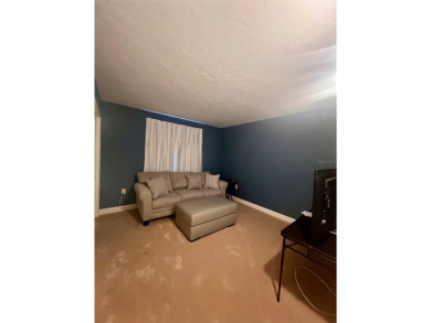 Welcome to this stunning 2-bedroom, 2-bathroom first-floor condo on East Lake Woodlands Country Club in Florida - for sale on GolfHomes.com, golf home, golf lot