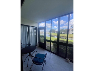 Welcome to this stunning 2-bedroom, 2-bathroom first-floor condo on East Lake Woodlands Country Club in Florida - for sale on GolfHomes.com, golf home, golf lot