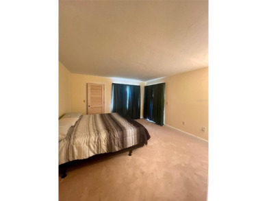 Welcome to this stunning 2-bedroom, 2-bathroom first-floor condo on East Lake Woodlands Country Club in Florida - for sale on GolfHomes.com, golf home, golf lot