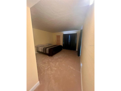 Welcome to this stunning 2-bedroom, 2-bathroom first-floor condo on East Lake Woodlands Country Club in Florida - for sale on GolfHomes.com, golf home, golf lot