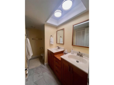 Welcome to this stunning 2-bedroom, 2-bathroom first-floor condo on East Lake Woodlands Country Club in Florida - for sale on GolfHomes.com, golf home, golf lot