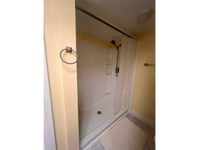 Welcome to this stunning 2-bedroom, 2-bathroom first-floor condo on East Lake Woodlands Country Club in Florida - for sale on GolfHomes.com, golf home, golf lot