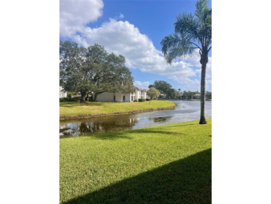 Welcome to this stunning 2-bedroom, 2-bathroom first-floor condo on East Lake Woodlands Country Club in Florida - for sale on GolfHomes.com, golf home, golf lot