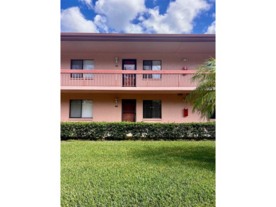 Welcome to this stunning 2-bedroom, 2-bathroom first-floor condo on East Lake Woodlands Country Club in Florida - for sale on GolfHomes.com, golf home, golf lot