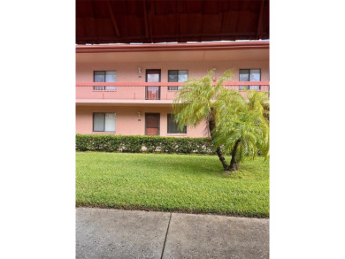 Welcome to this stunning 2-bedroom, 2-bathroom first-floor condo on East Lake Woodlands Country Club in Florida - for sale on GolfHomes.com, golf home, golf lot