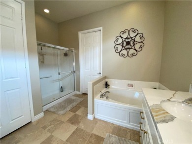 Welcome to this beautifully upgraded Emerald model home, located on Oak Valley Golf Club in California - for sale on GolfHomes.com, golf home, golf lot