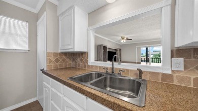 This charming waterfront condo offers a fantastic opportunity to on De Cordova Bend Country Club in Texas - for sale on GolfHomes.com, golf home, golf lot