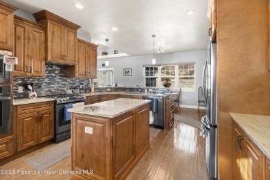 Nestled on over 2 acres of picturesque land, this custom-built on Rifle Creek Golf Course in Colorado - for sale on GolfHomes.com, golf home, golf lot