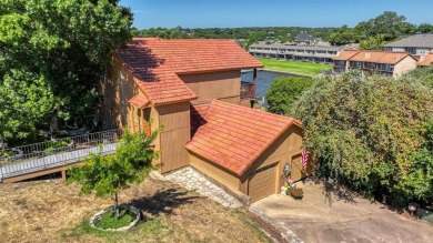This charming waterfront condo offers a fantastic opportunity to on De Cordova Bend Country Club in Texas - for sale on GolfHomes.com, golf home, golf lot