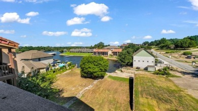 This charming waterfront condo offers a fantastic opportunity to on De Cordova Bend Country Club in Texas - for sale on GolfHomes.com, golf home, golf lot