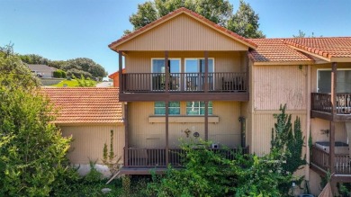 This charming waterfront condo offers a fantastic opportunity to on De Cordova Bend Country Club in Texas - for sale on GolfHomes.com, golf home, golf lot