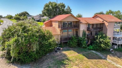 This charming waterfront condo offers a fantastic opportunity to on De Cordova Bend Country Club in Texas - for sale on GolfHomes.com, golf home, golf lot