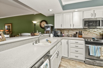 Perched overlooking the golf course, this  two-bedroom on Pointe Royale Village Country Club in Missouri - for sale on GolfHomes.com, golf home, golf lot