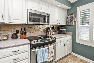 Perched overlooking the golf course, this  two-bedroom on Pointe Royale Village Country Club in Missouri - for sale on GolfHomes.com, golf home, golf lot