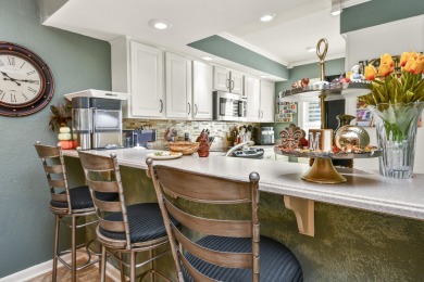 Perched overlooking the golf course, this  two-bedroom on Pointe Royale Village Country Club in Missouri - for sale on GolfHomes.com, golf home, golf lot