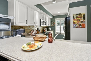 Perched overlooking the golf course, this  two-bedroom on Pointe Royale Village Country Club in Missouri - for sale on GolfHomes.com, golf home, golf lot