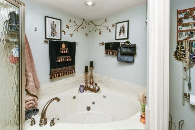 Perched overlooking the golf course, this  two-bedroom on Pointe Royale Village Country Club in Missouri - for sale on GolfHomes.com, golf home, golf lot