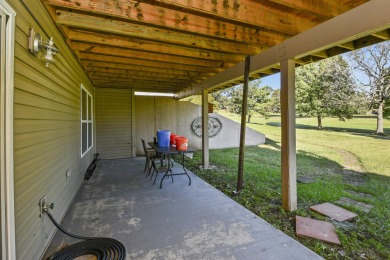 Perched overlooking the golf course, this  two-bedroom on Pointe Royale Village Country Club in Missouri - for sale on GolfHomes.com, golf home, golf lot