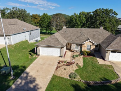 Perched overlooking the golf course, this  two-bedroom on Pointe Royale Village Country Club in Missouri - for sale on GolfHomes.com, golf home, golf lot